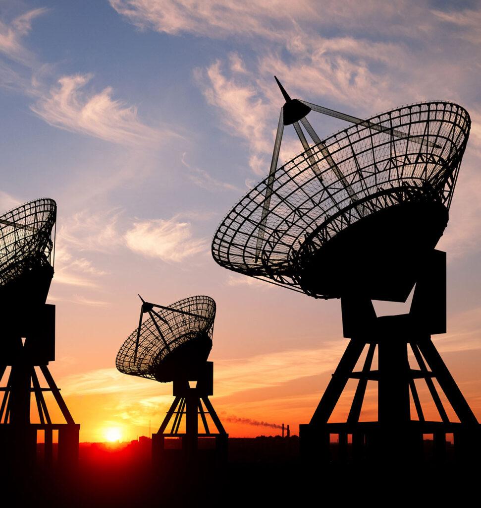 military and defense antenna against a sunset