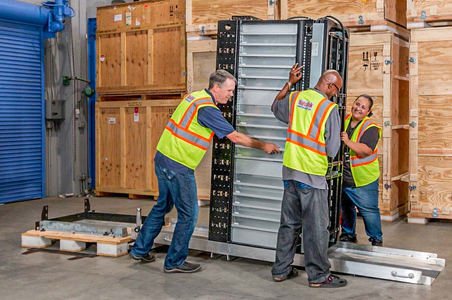 transpak team opening a large data server crate