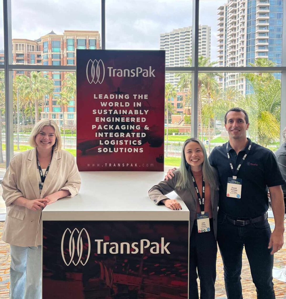 transpak-team-at-trade-show-at-branded-booth-filled-with-transpak-products-and-solutions